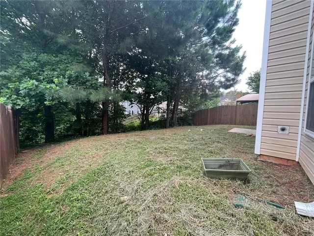 a backyard of a house with lots of green space
