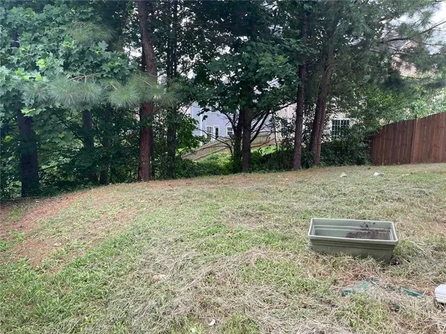 a backyard of a house with lots of green space