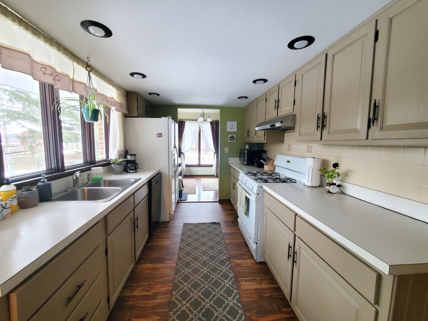 42W490 Kedeka Road Sugar Grove, IL 60554 - Photo 24 of 30 a kitchen with stainless steel appliances a sink stove and cabinets