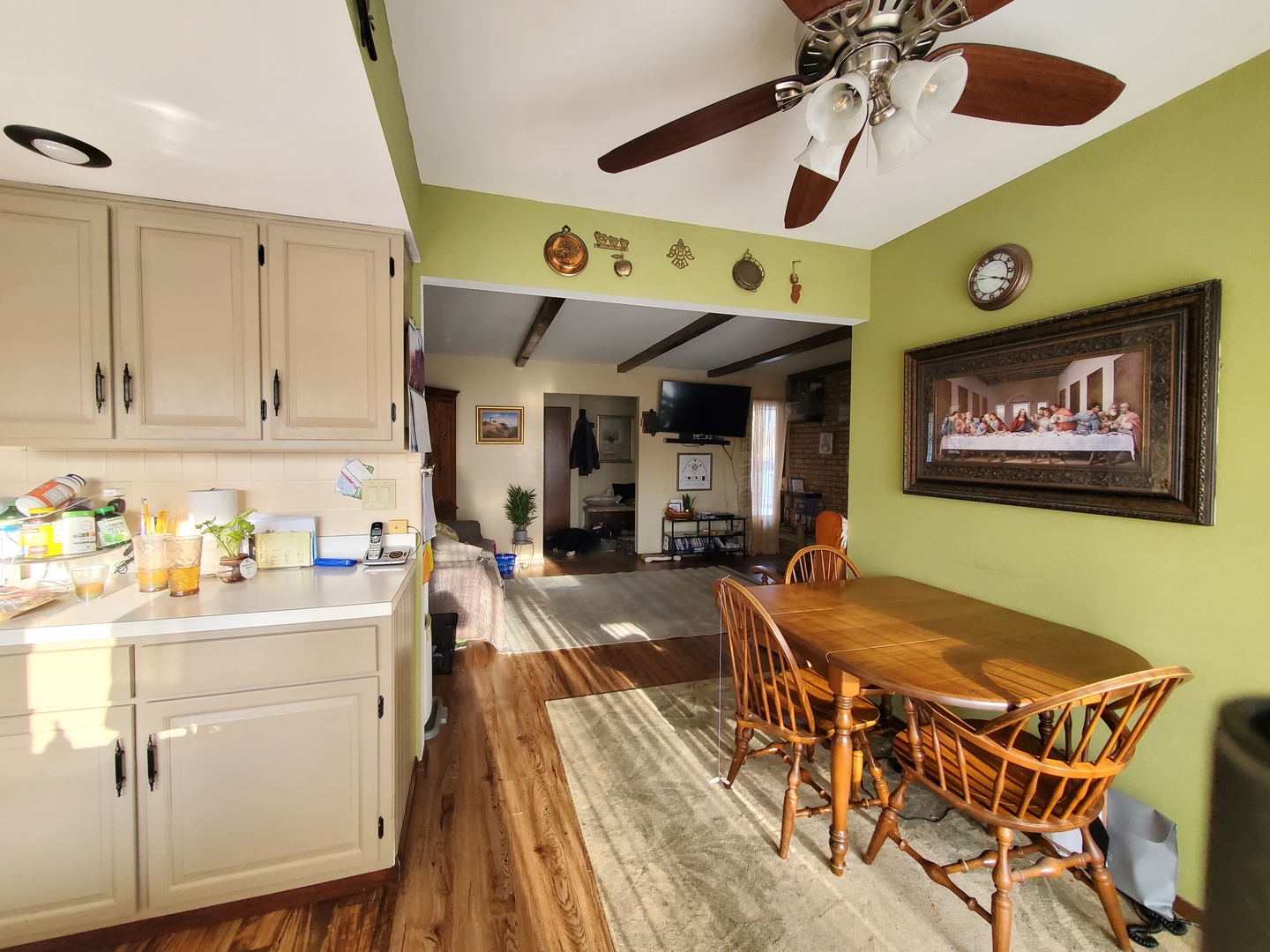 42W490 Kedeka Road Sugar Grove, IL 60554 - Photo 26 of 30 a living room with stainless steel appliances kitchen island granite countertop furniture and a wooden floor