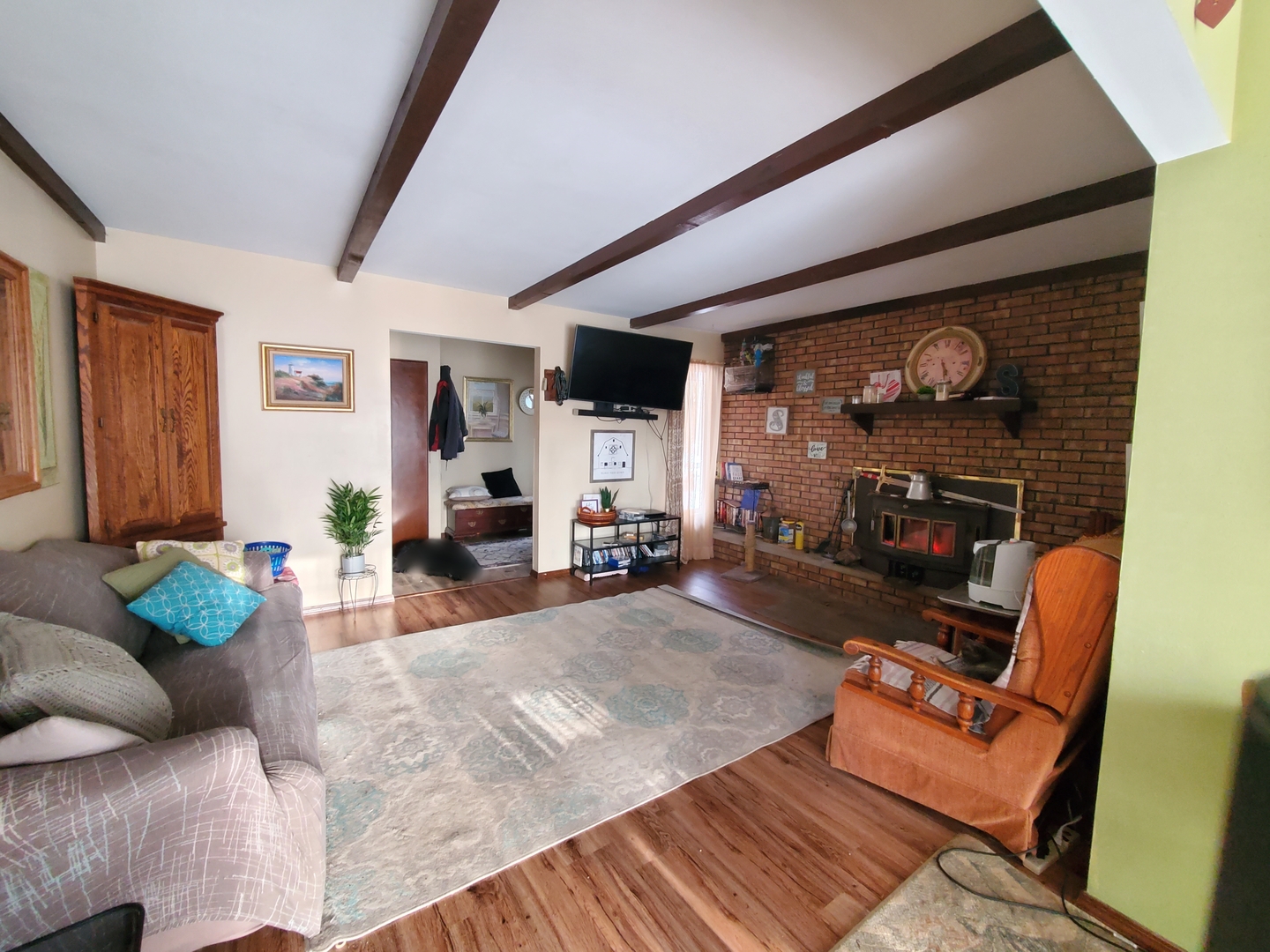 42W490 Kedeka Road Sugar Grove, IL 60554 - Photo 27 of 30 a living room with furniture and a fireplace