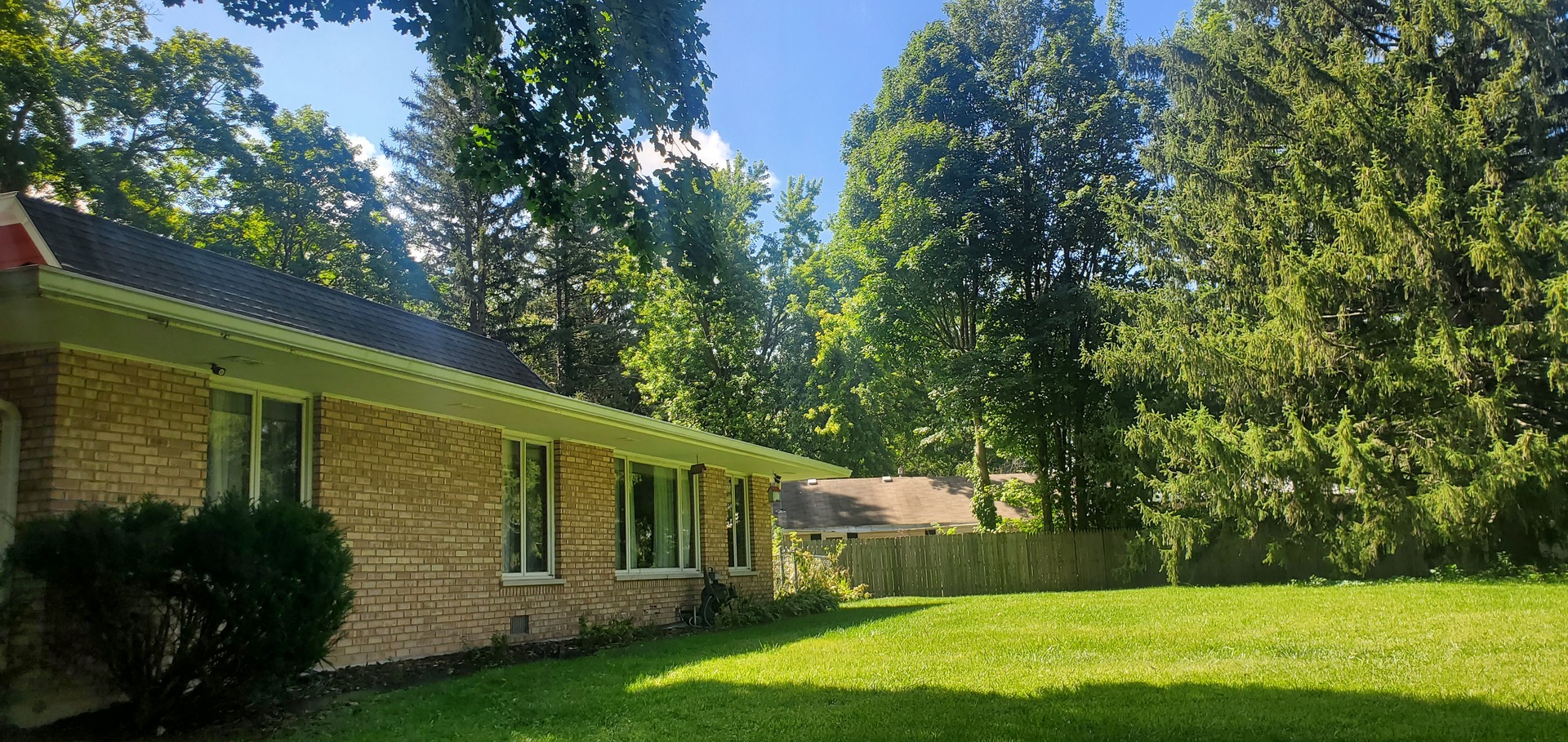 42W490 Kedeka Road Sugar Grove, IL 60554 - Photo 5 of 30 a view of a backyard with large trees