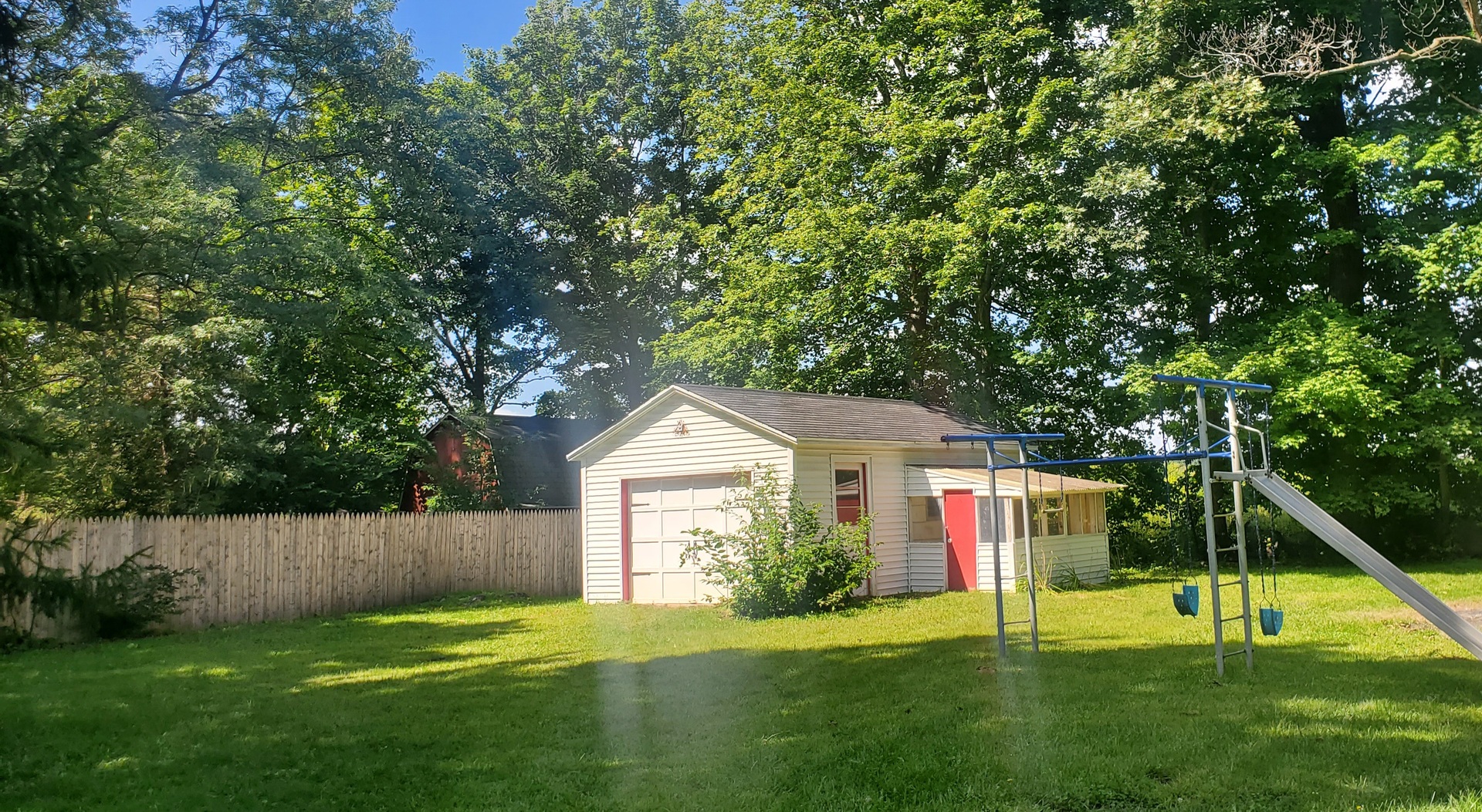 42W490 Kedeka Road Sugar Grove, IL 60554 - Photo 8 of 30 a view of a house with a backyard and a tree
