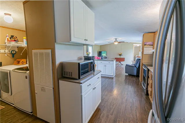 a kitchen with stainless steel appliances a stove a sink and a refrigerator