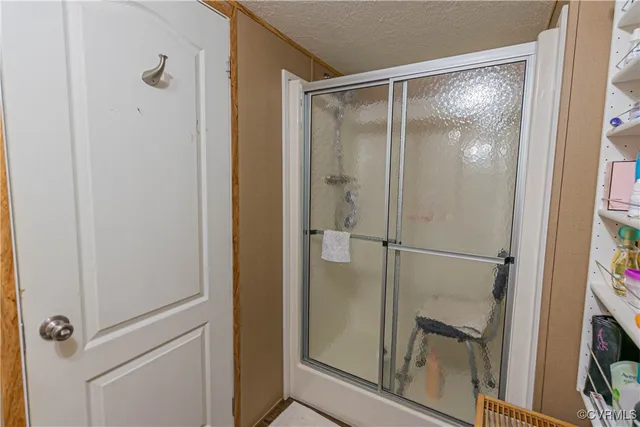 a bathroom with a toilet a sink and a shower