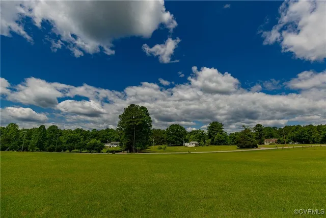 a view of a golf course with a lake