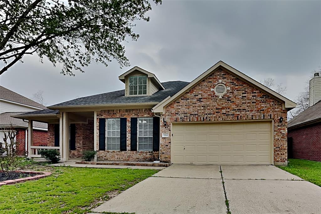 1314 Buchans Drive Spring, TX 77386 - Photo 1 of 19 front view of house with a yard