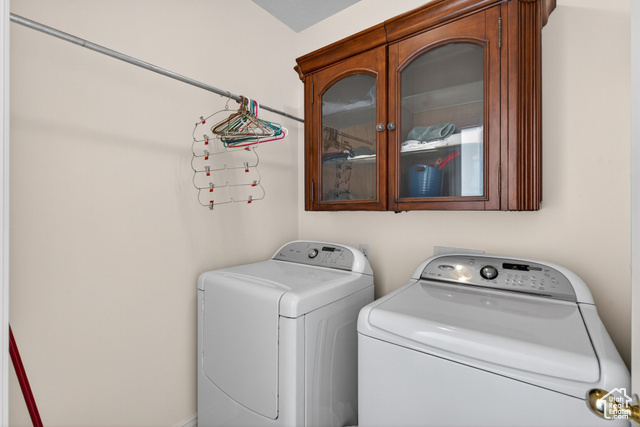 4768 East Hickman Canyon Road Stockton, UT 84071 - Photo 27 of 85 Second floor laundry area featuring washer and clothes dryer.