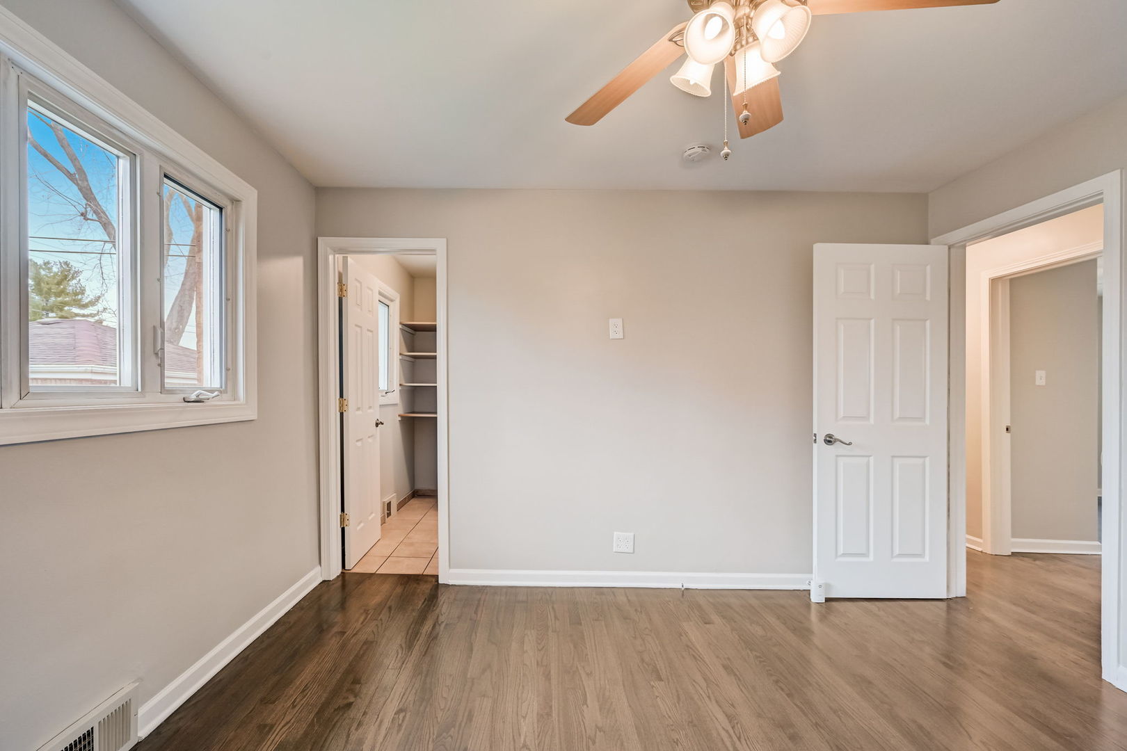 3132 Willow Road South Chicago Heights, IL 60411 - Photo 14 of 26 a view of an empty room with wooden floor and a window
