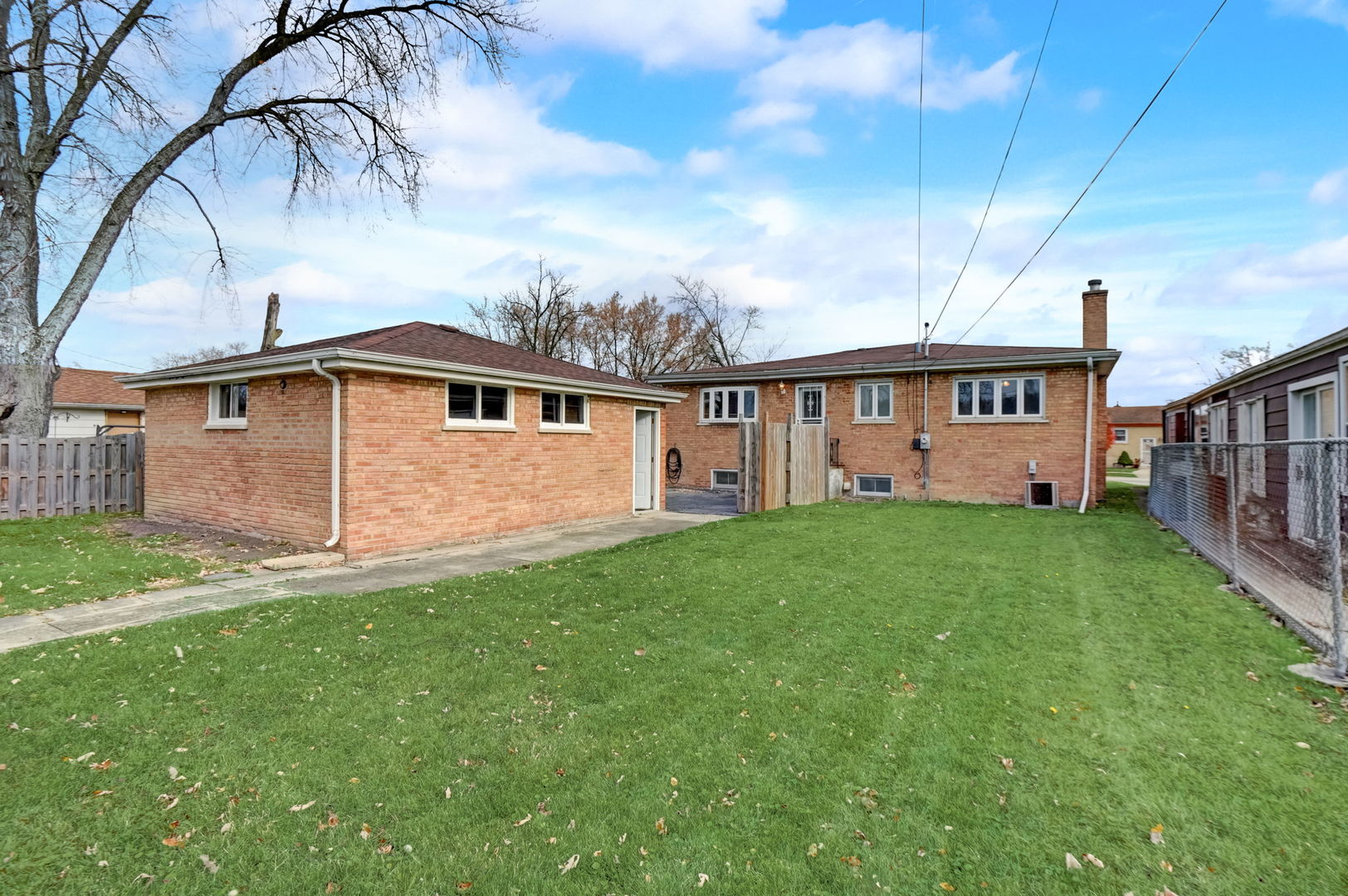 3132 Willow Road South Chicago Heights, IL 60411 - Photo 21 of 26 a front view of a house with a garden