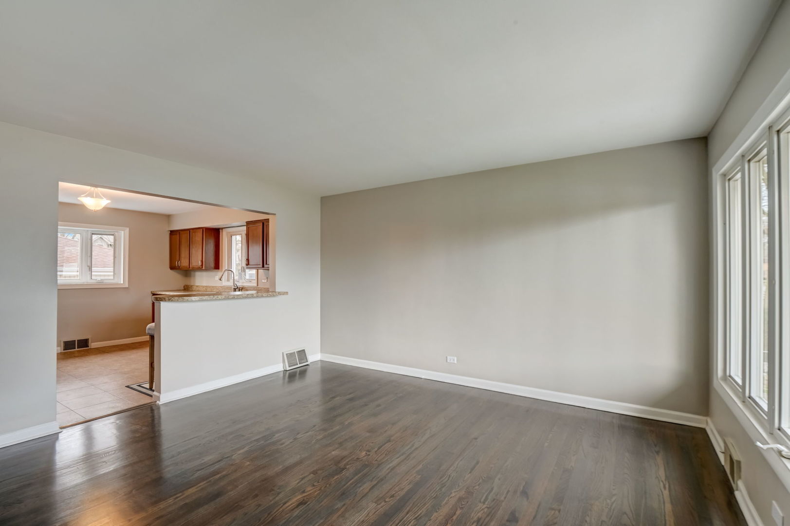 3132 Willow Road South Chicago Heights, IL 60411 - Photo 6 of 26 an empty room with a wooden floor and a window