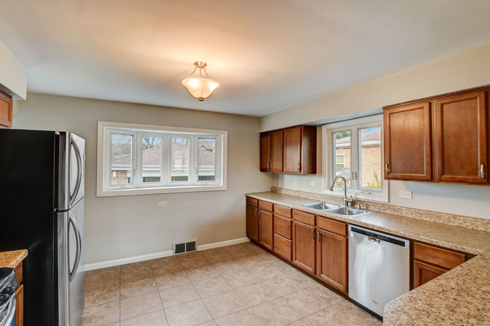 3132 Willow Road South Chicago Heights, IL 60411 - Photo 7 of 26 a kitchen with stainless steel appliances granite countertop a refrigerator and a sink