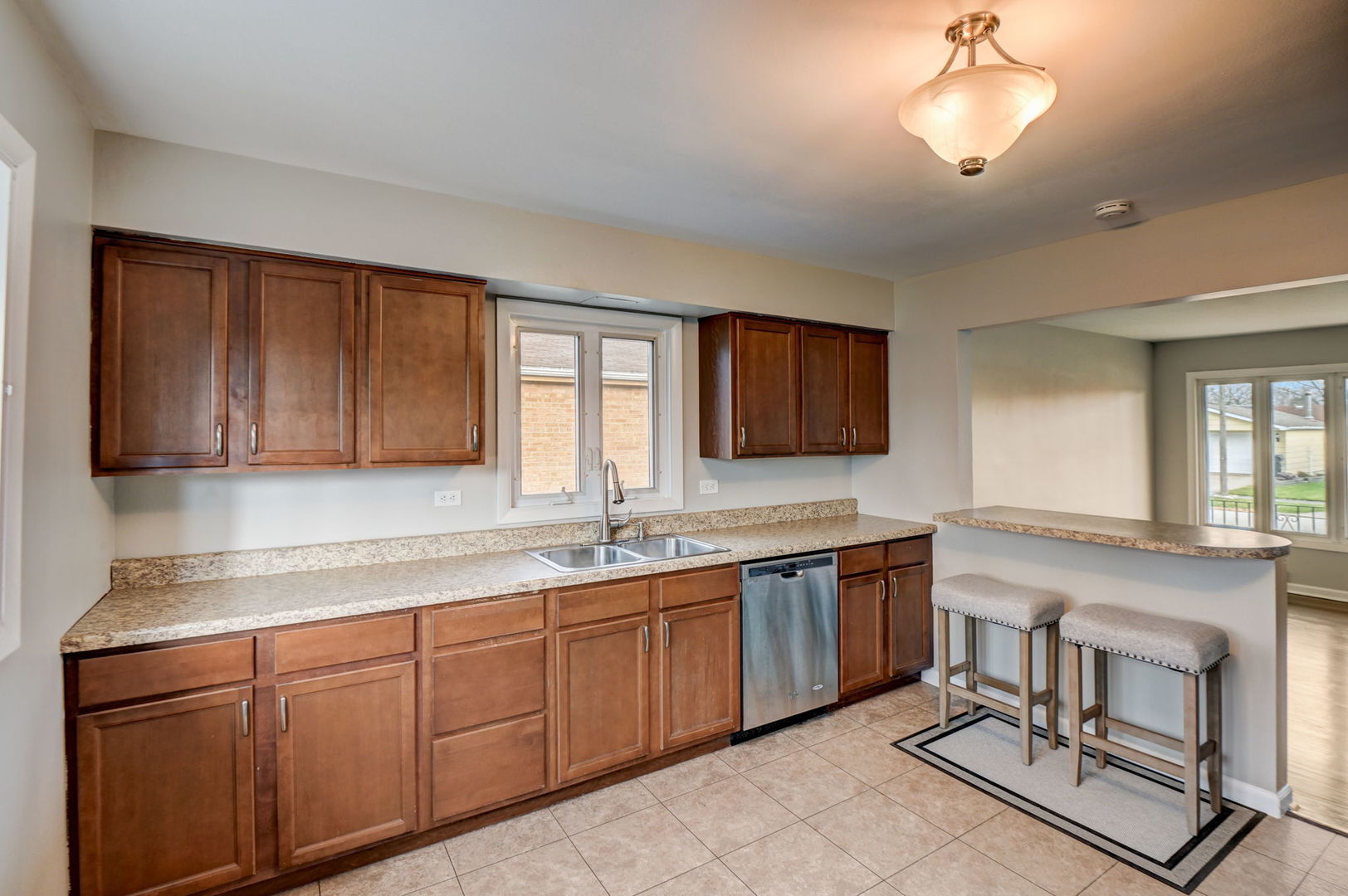 3132 Willow Road South Chicago Heights, IL 60411 - Photo 9 of 26 a kitchen with a sink cabinets and window