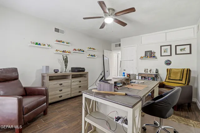 a view of a workspace with furniture