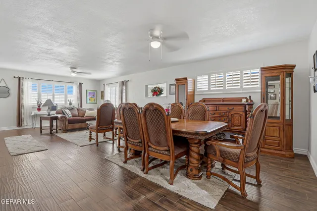a view of a dining room with furniture and wooden floor