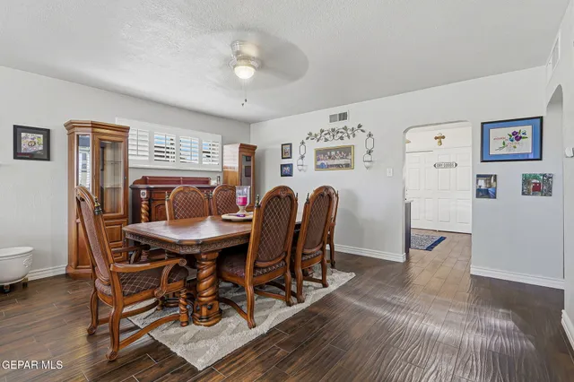 a view of a dining room with furniture and wooden floor