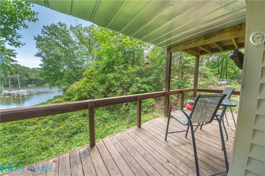 54 Villa Ridge Drive, Unit C Hartfield, VA 23071 - Photo 8 of 45 Wooden deck featuring a water view