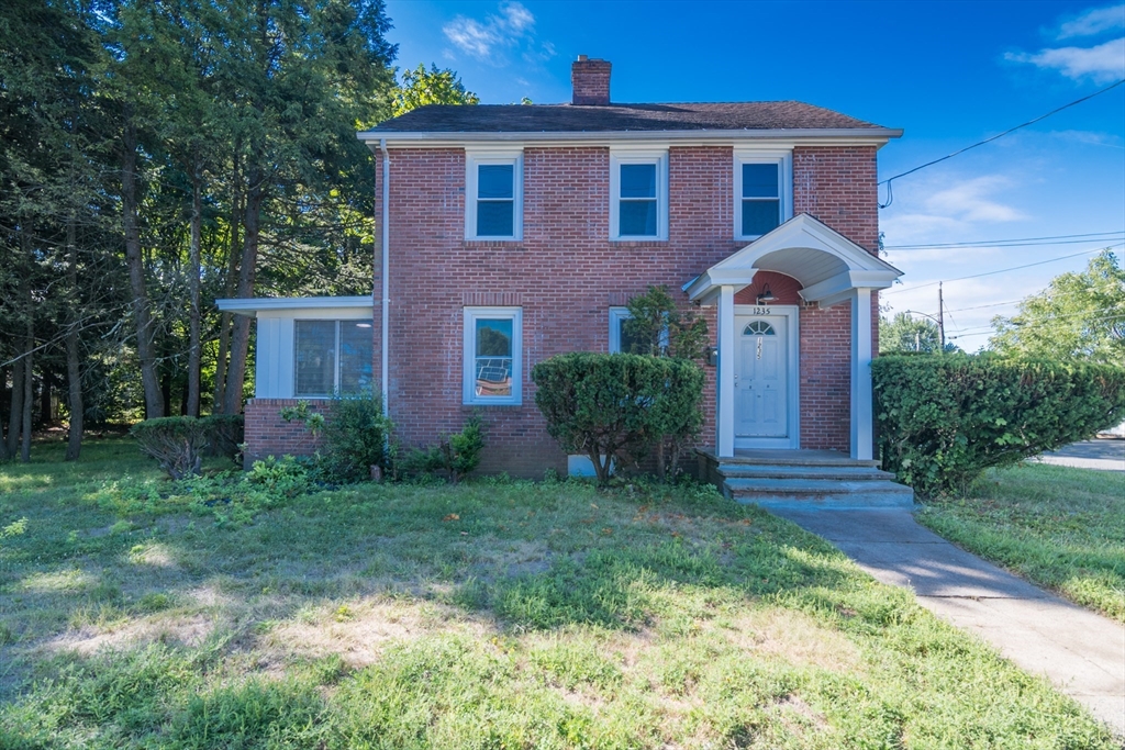1235 Bay Street Springfield, MA 01109 - Photo 1 of 35 a front view of a house with garden