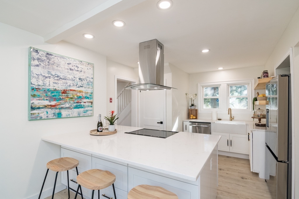 1235 Bay Street Springfield, MA 01109 - Photo 17 of 35 a kitchen with stainless steel appliances a table and chairs