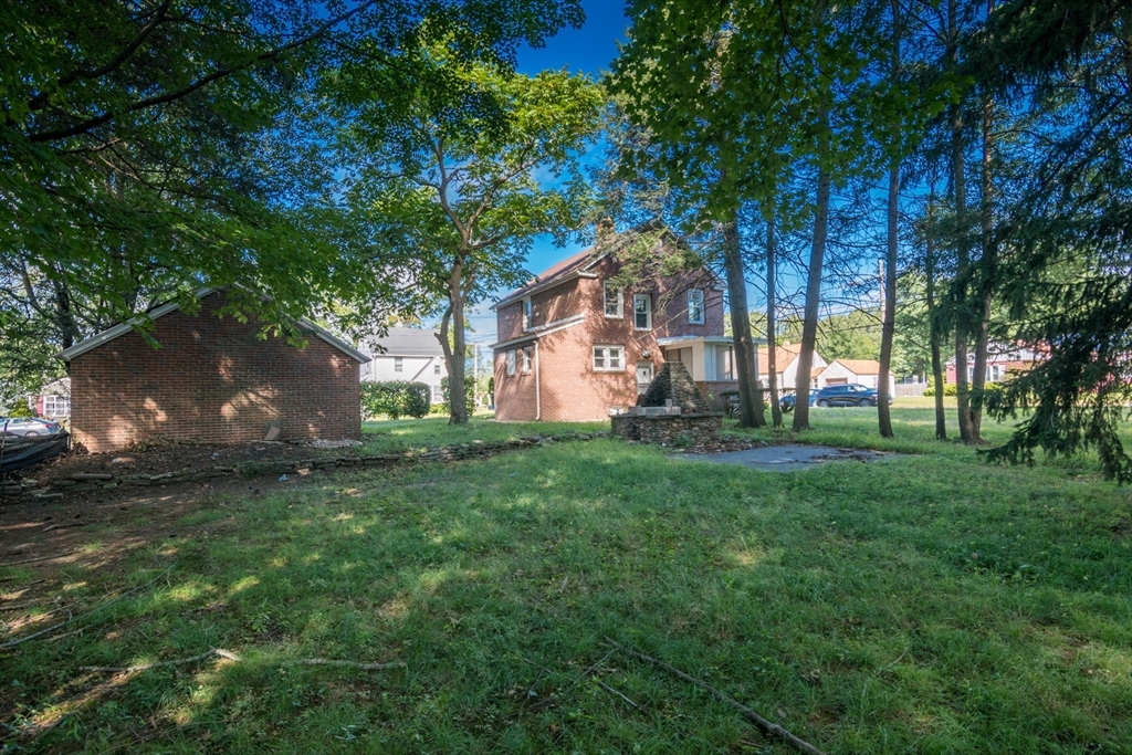 1235 Bay Street Springfield, MA 01109 - Photo 7 of 35 a view of a backyard with large trees