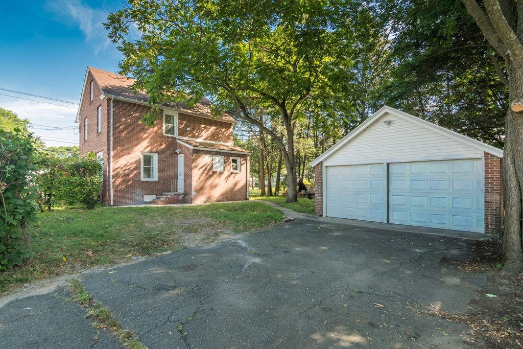 1235 Bay Street Springfield, MA 01109 - Photo 9 of 35 a view of a house with a yard and garage