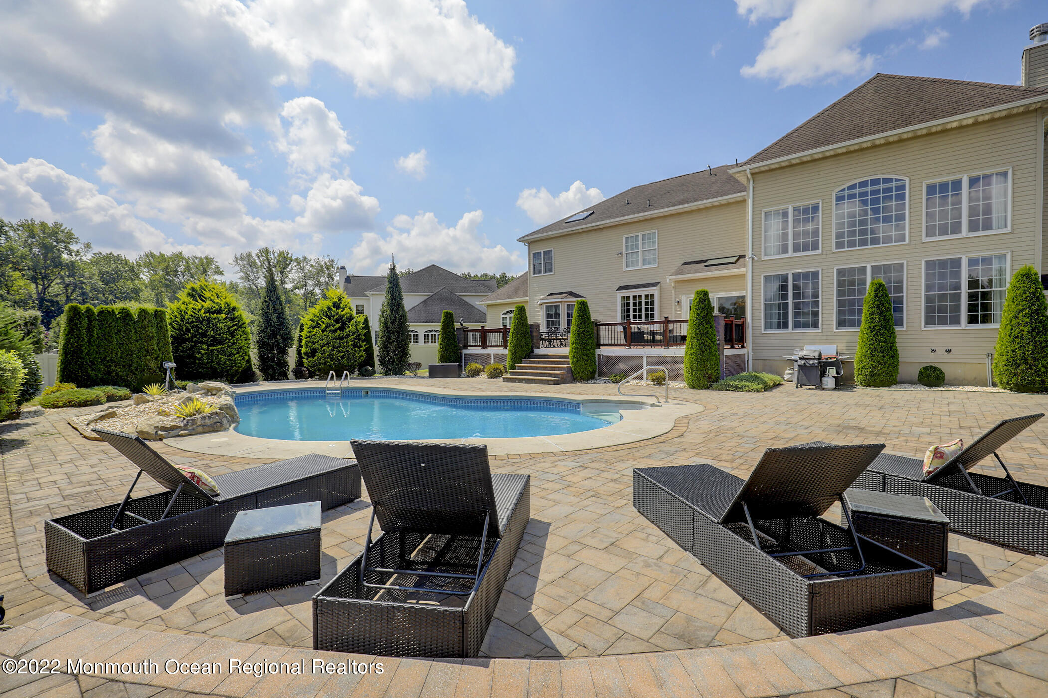 19 Rockingham Court Manalapan, NJ 07726 - Photo 45 of 52 a roof deck with couches and pool