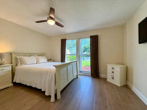 a bed room with a bed and a window