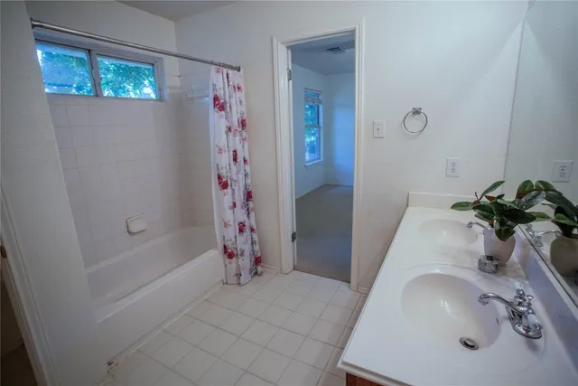 a view of a room with wooden floor and natural light