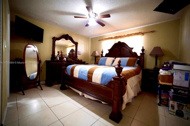 a bed room with a bed and a chandelier