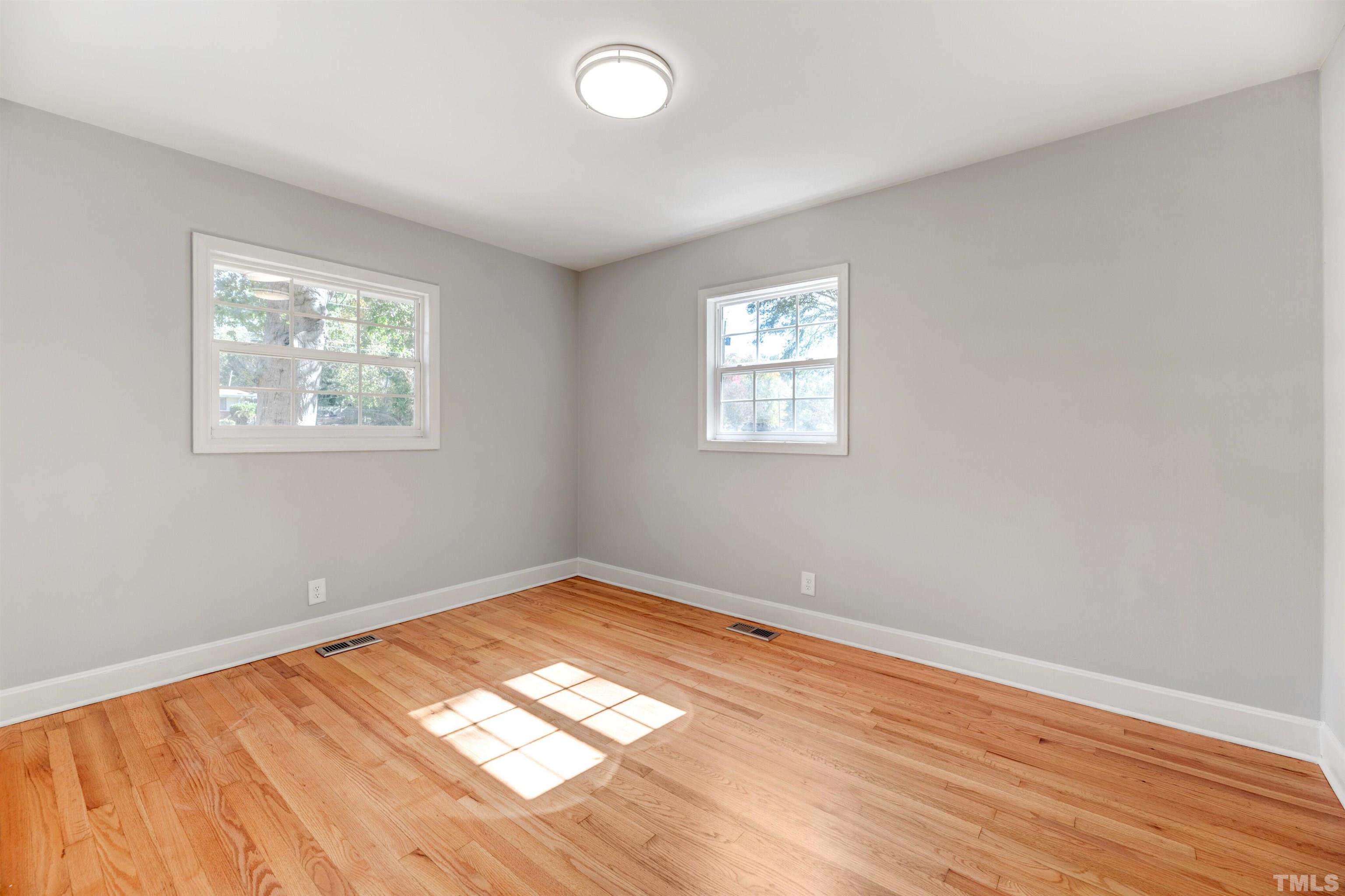 618 Starmont Drive Durham, NC 27705 - Photo 24 of 45 wooden floor in an empty room with a window