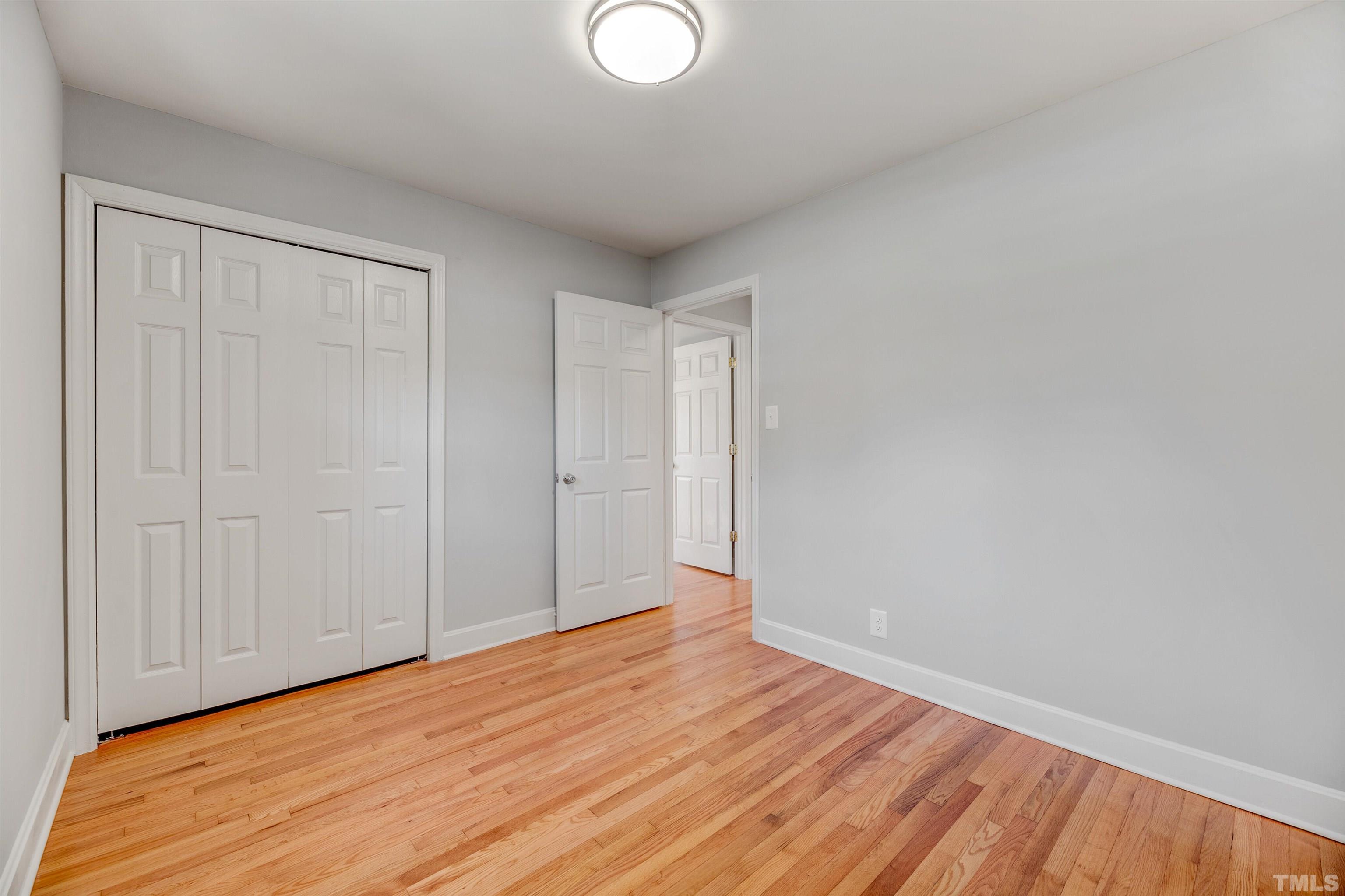 618 Starmont Drive Durham, NC 27705 - Photo 27 of 45 a view of an empty room with wooden floor