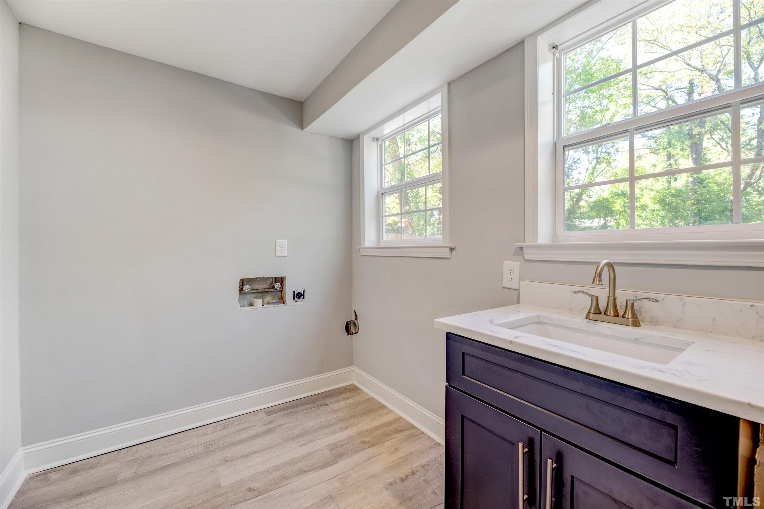618 Starmont Drive Durham, NC 27705 - Photo 35 of 45 a bathroom with a sink and a window