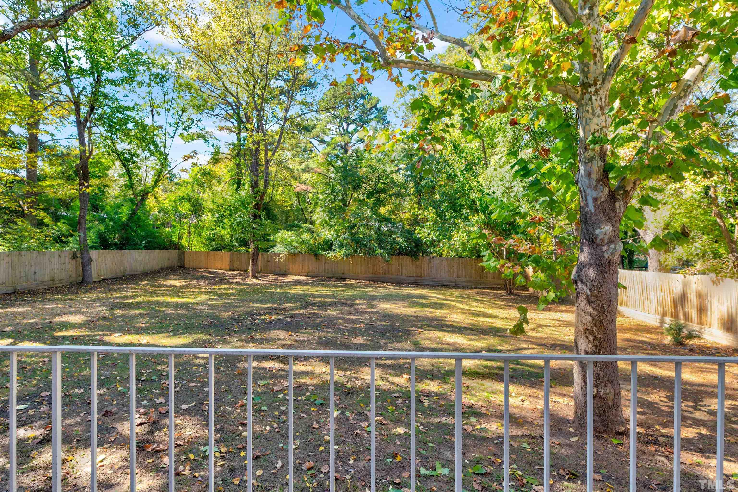 618 Starmont Drive Durham, NC 27705 - Photo 36 of 45 a view of a yard with large trees