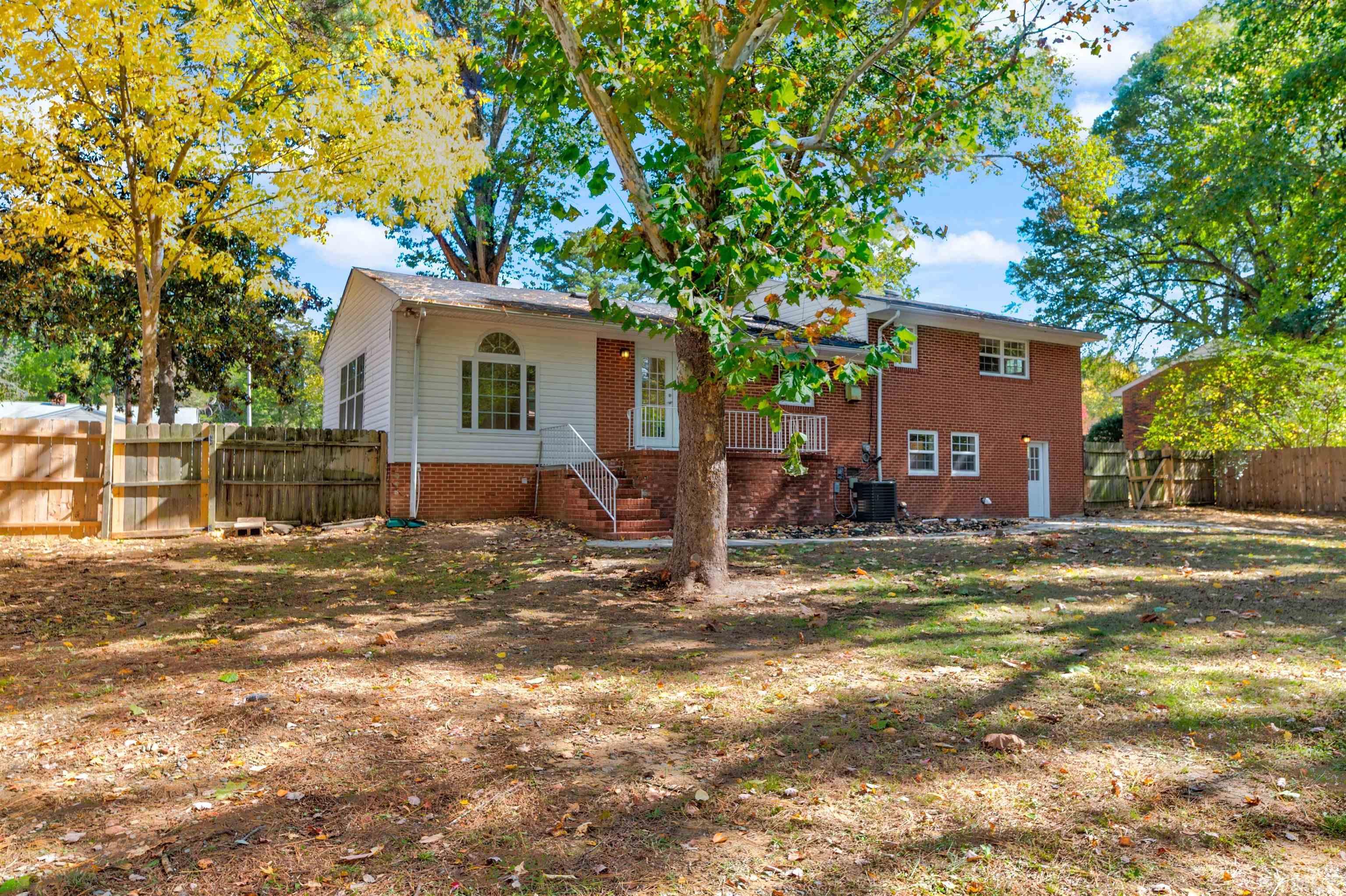 618 Starmont Drive Durham, NC 27705 - Photo 37 of 45 a view of a house with a yard