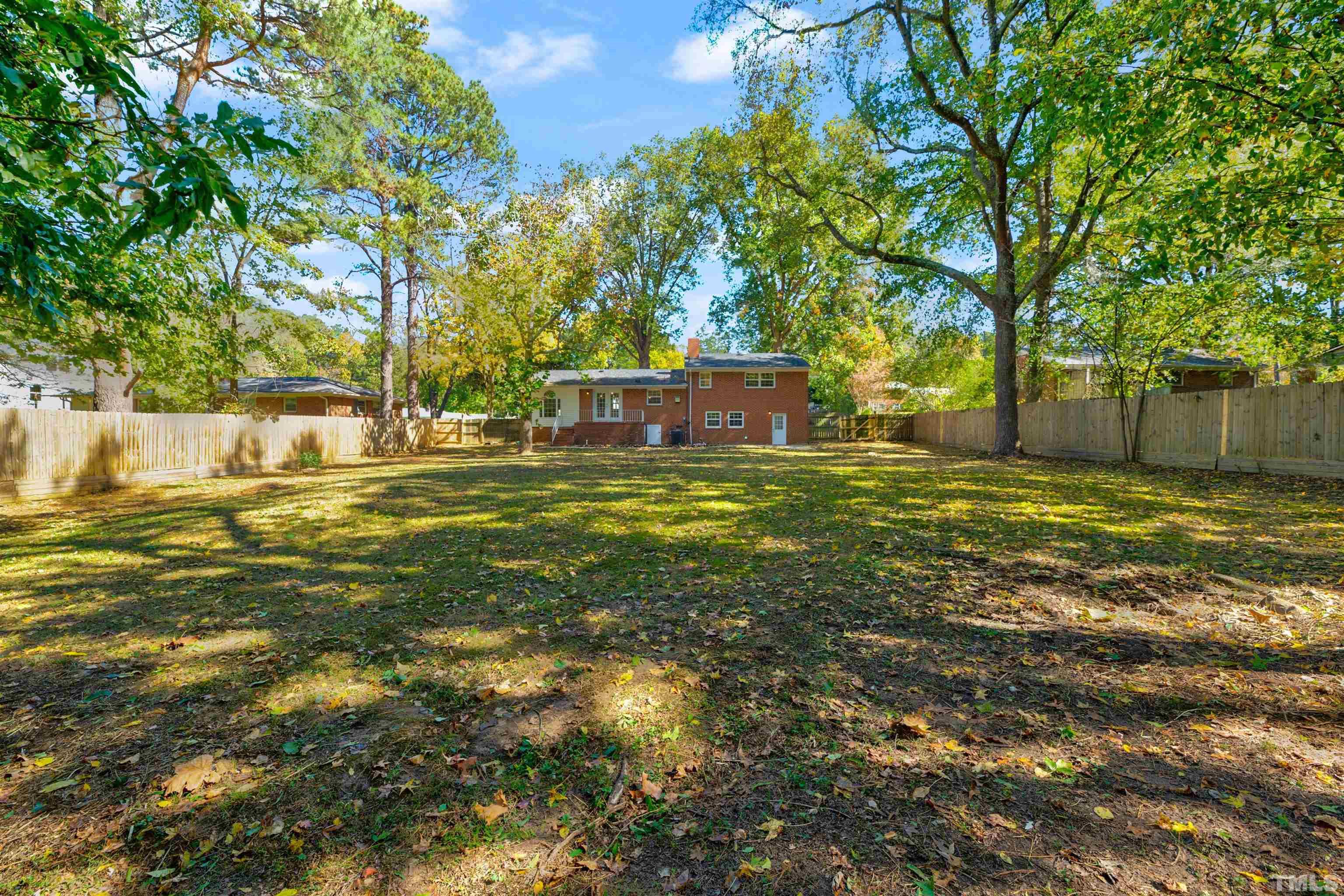 618 Starmont Drive Durham, NC 27705 - Photo 38 of 45 a view of a house with a yard