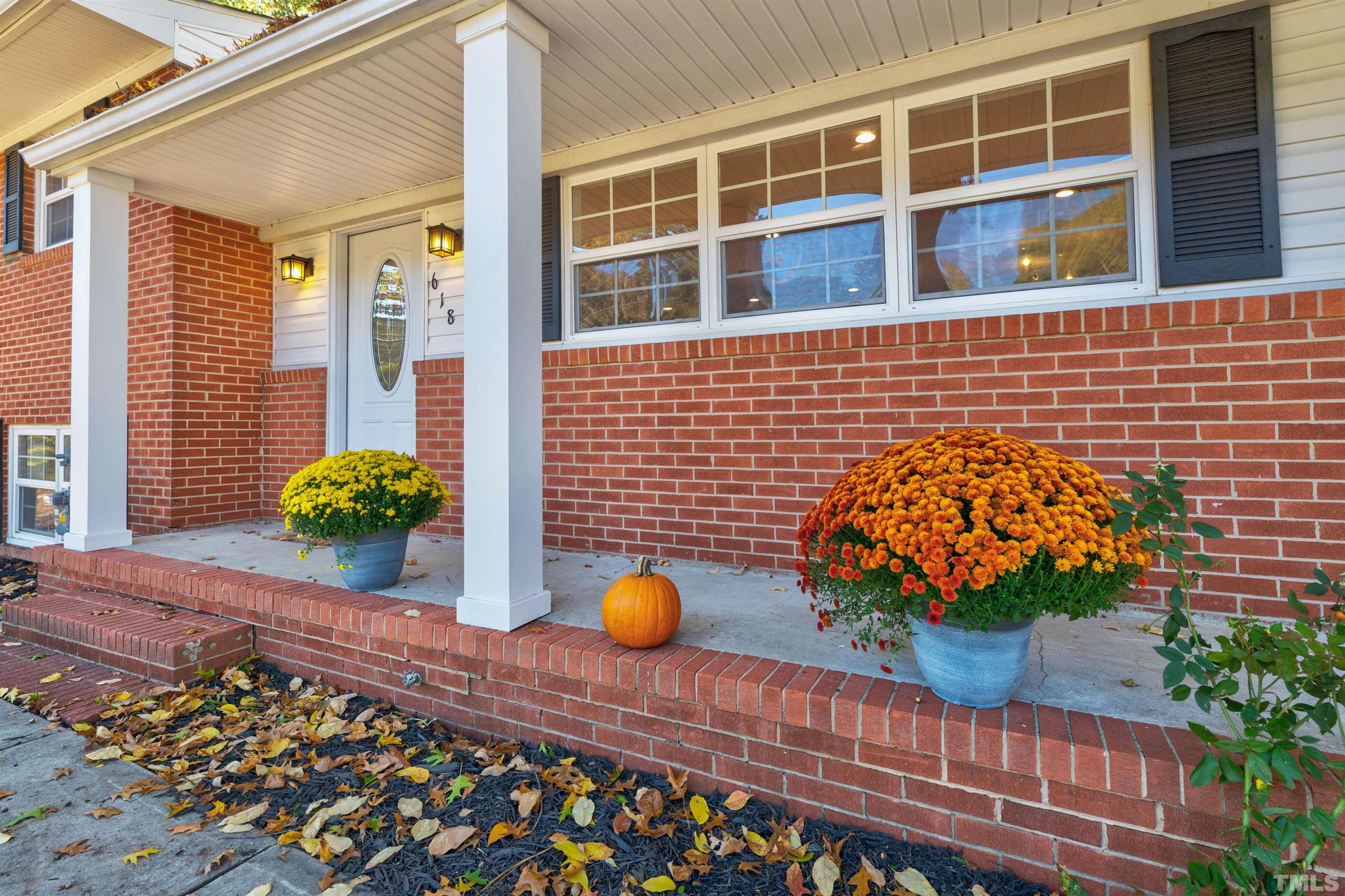 618 Starmont Drive Durham, NC 27705 - Photo 5 of 45 a view of a backyard with chairs and a potted plant