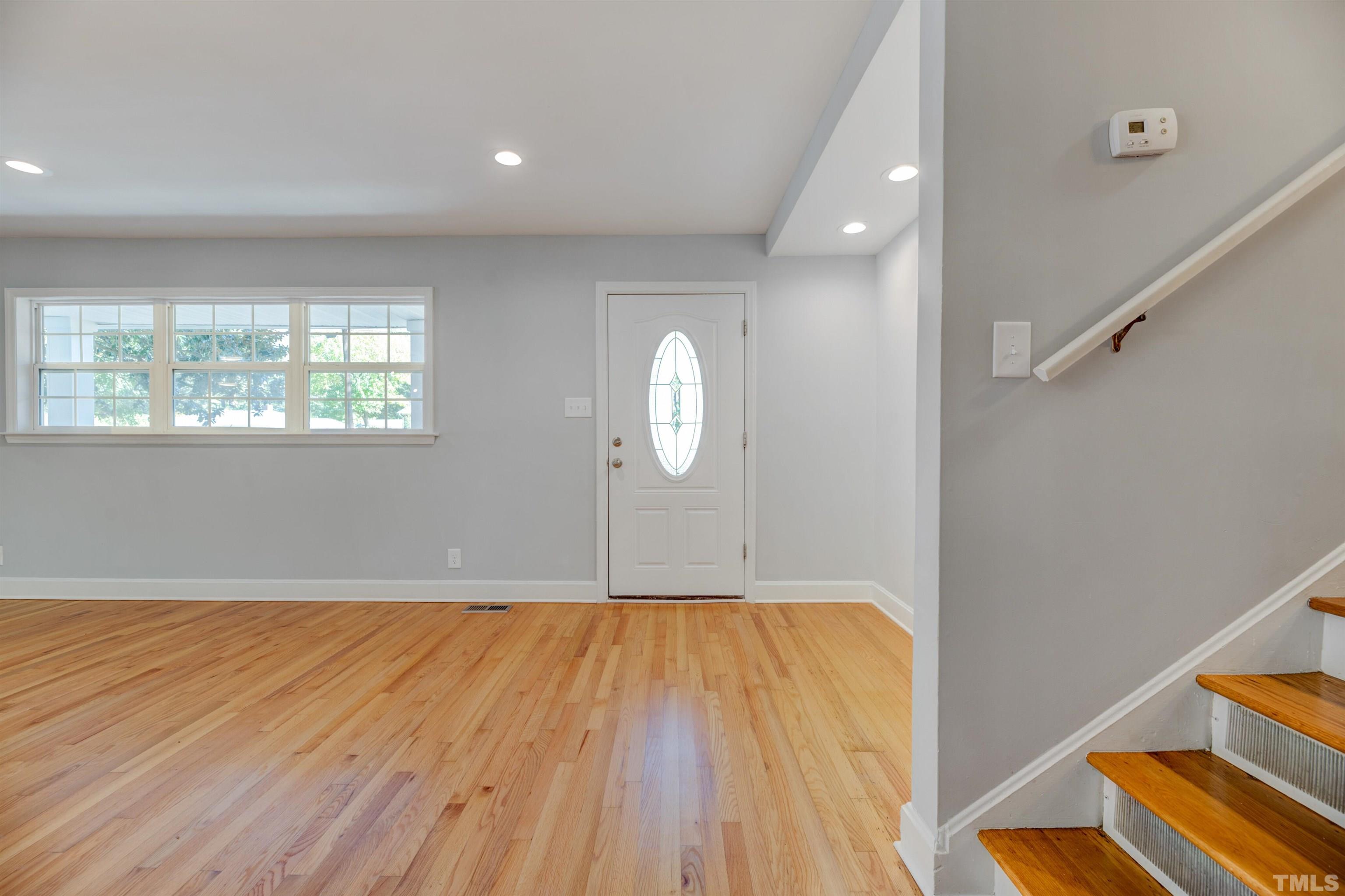618 Starmont Drive Durham, NC 27705 - Photo 8 of 45 a view of a room with wooden floor and window