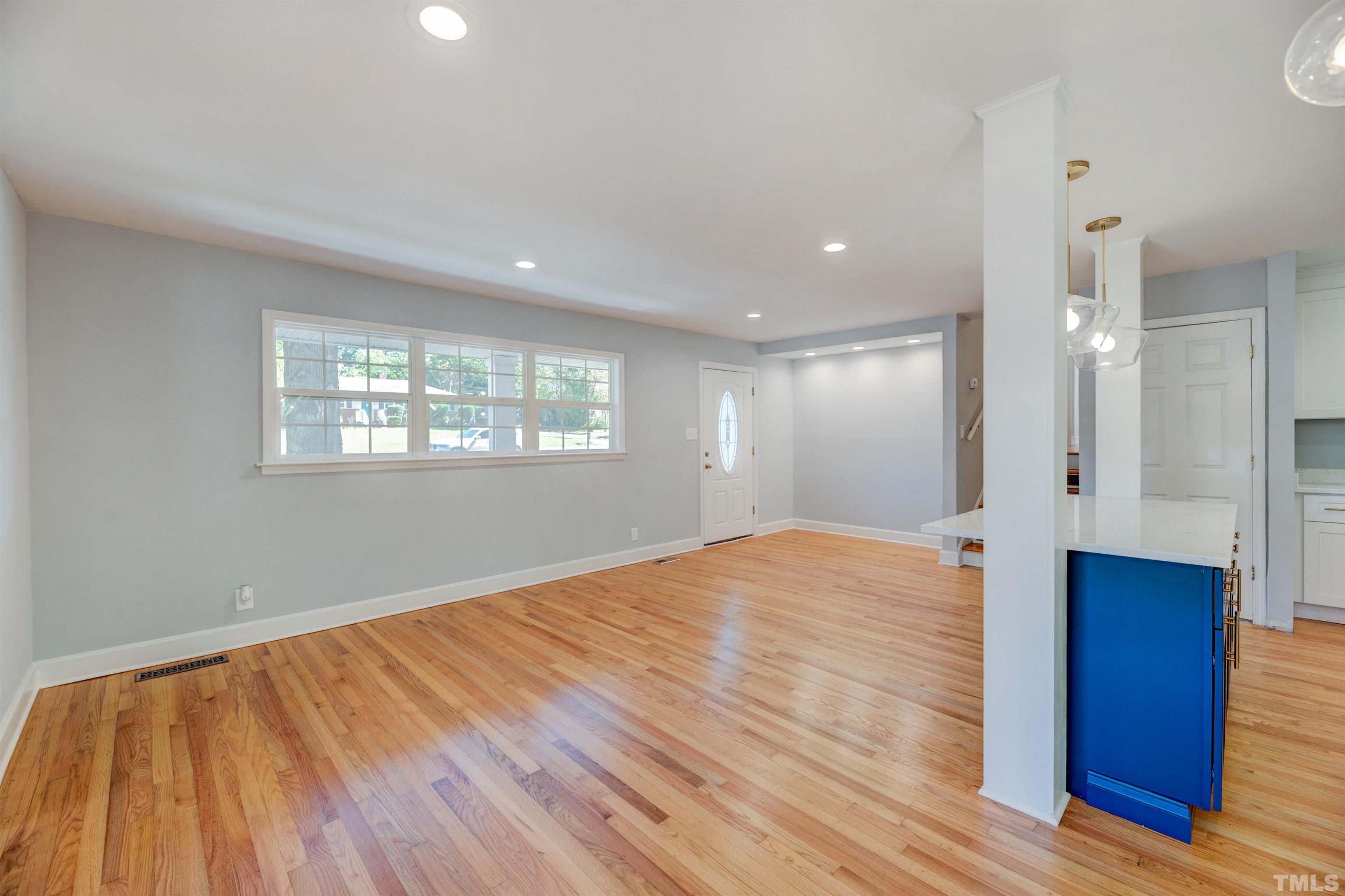 618 Starmont Drive Durham, NC 27705 - Photo 9 of 45 a view of empty room with wooden floor and fan