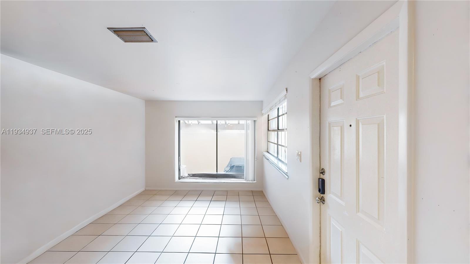 13292 Southwest 114th Terrace Miami, FL 33186 - Photo 11 of 65 a view of an empty room with window