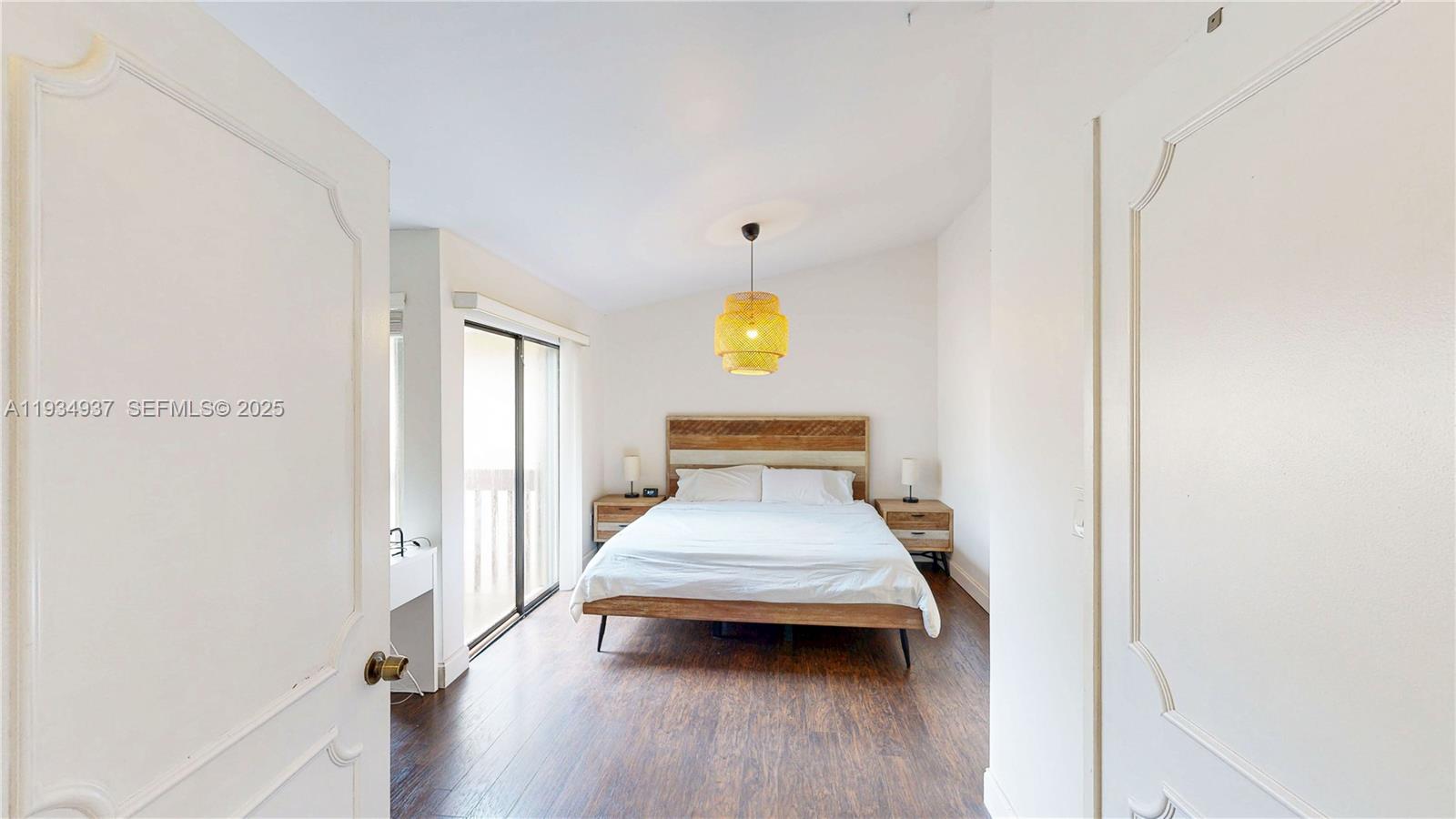 13292 Southwest 114th Terrace Miami, FL 33186 - Photo 20 of 65 a view of a bedroom with wooden floor and furniture