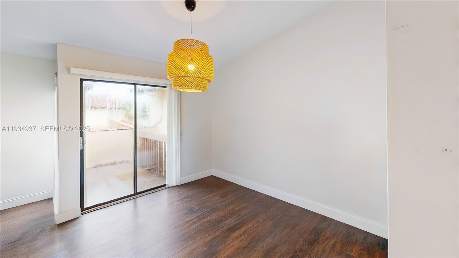 13292 Southwest 114th Terrace Miami, FL 33186 - Photo 26 of 65 a view of a room with wooden floor and windows