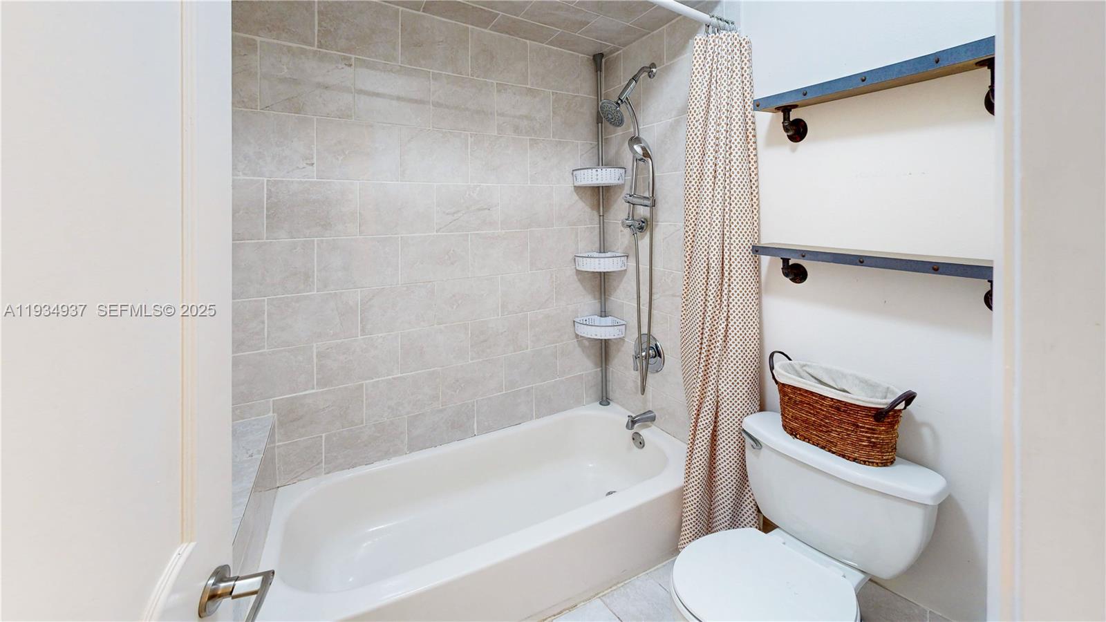 13292 Southwest 114th Terrace Miami, FL 33186 - Photo 32 of 65 a bathroom with a toilet and a bathtub