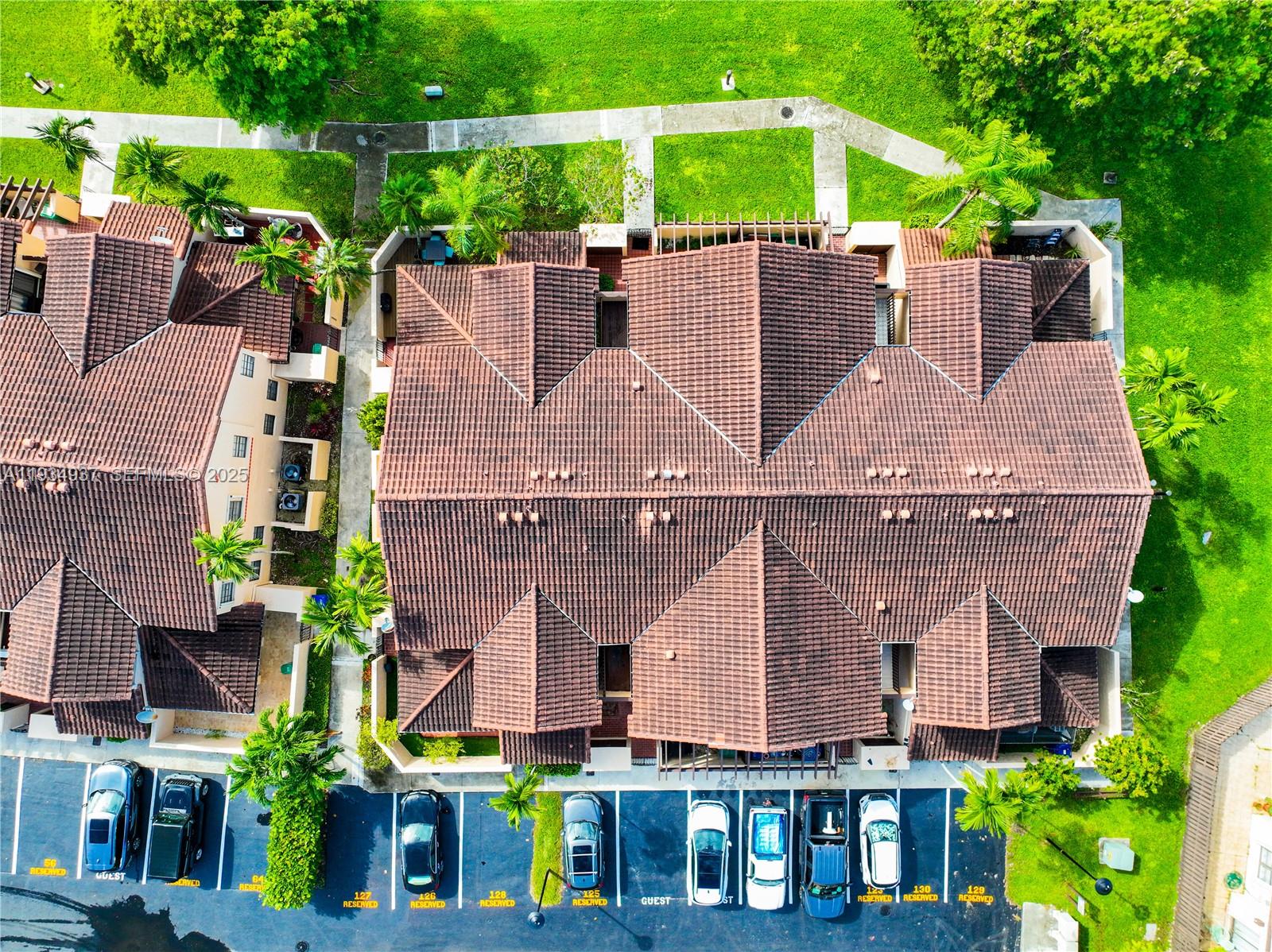 13292 Southwest 114th Terrace Miami, FL 33186 - Photo 48 of 65 an aerial view of multiple houses with a yard