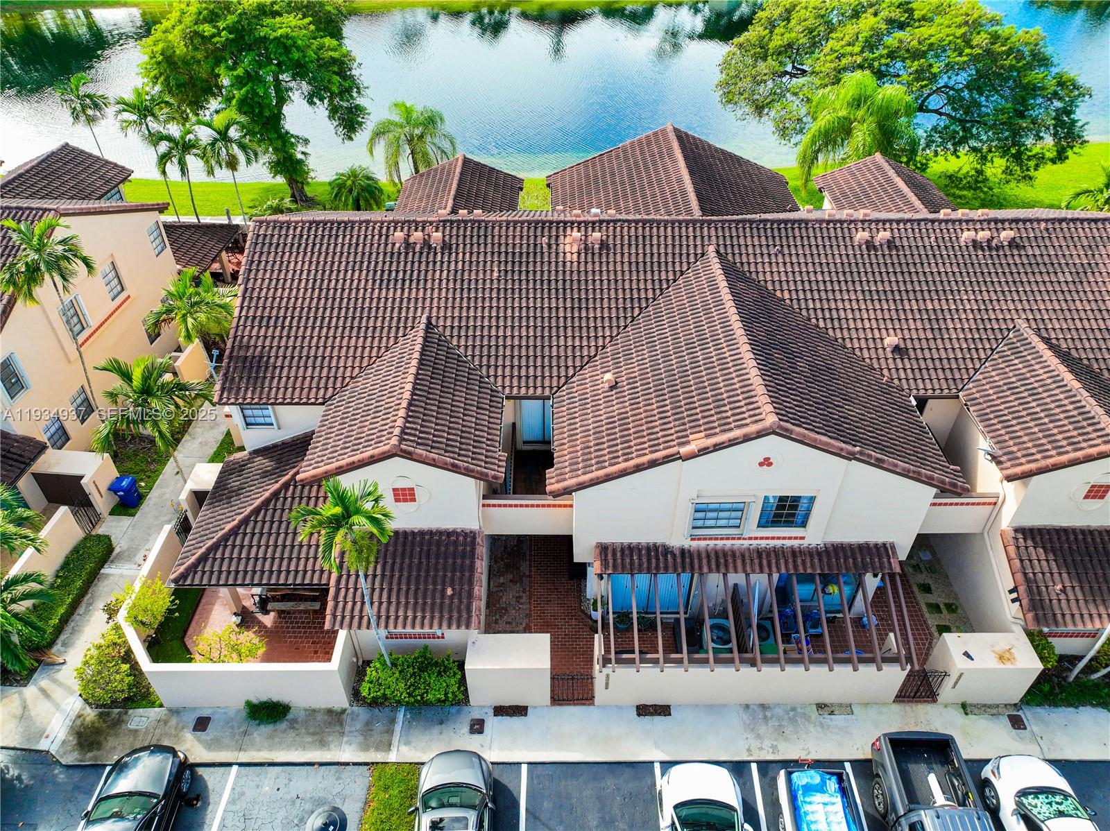 13292 Southwest 114th Terrace Miami, FL 33186 - Photo 49 of 65 a view of house with swimming pool and furniture