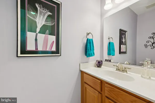a bathroom with a sink and mirror