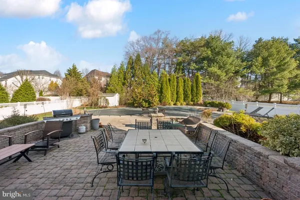 an outdoor space with furniture and garden