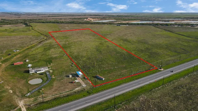 a view of a swimming pool and an outdoor seating