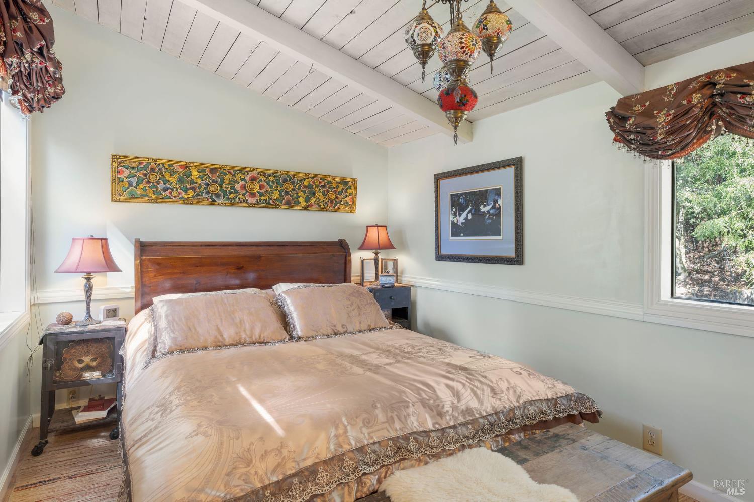 35570 Ocean View Street Gualala, CA 95445 - Photo 12 of 52 a bedroom with a bed and a painting on the wall