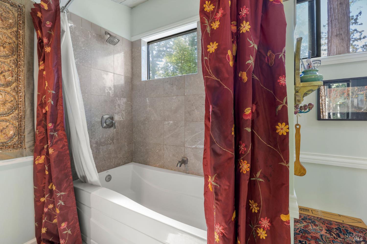 35570 Ocean View Street Gualala, CA 95445 - Photo 14 of 52 a bathroom with a bathtub and a shower