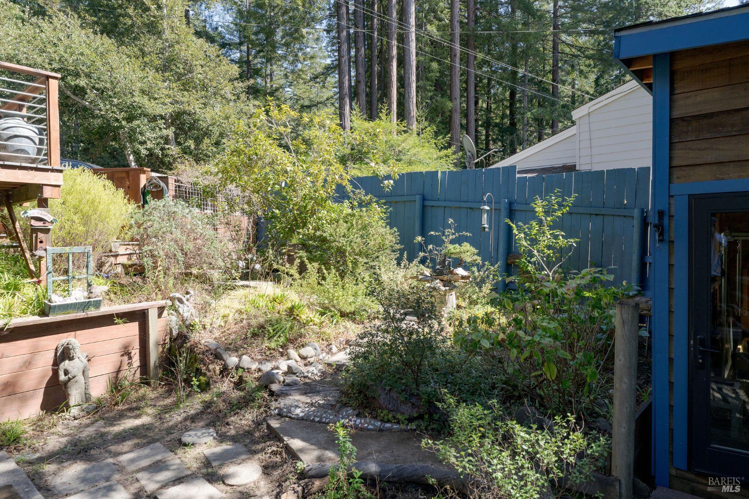 35570 Ocean View Street Gualala, CA 95445 - Photo 46 of 52 a backyard of a house with lots of green space